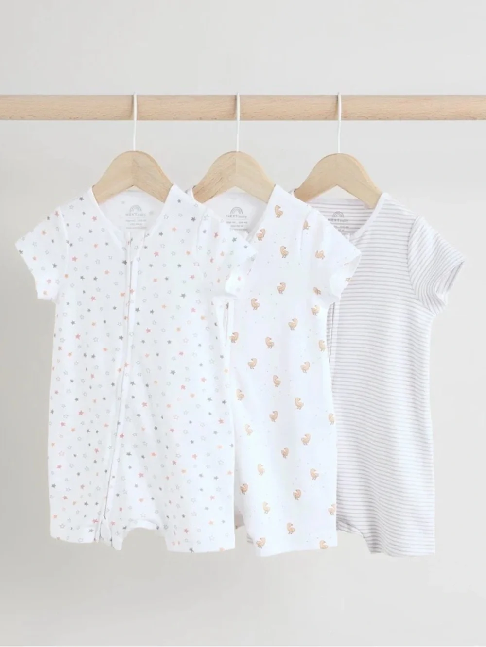 A set of 3 shortie rompers